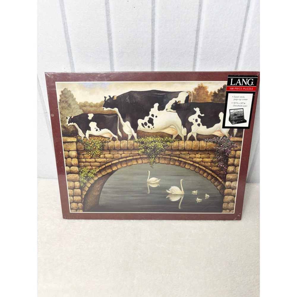 Lang Over the Bridge 500 Piece Jigsaw Puzzle Lowell Herrero Cows Swans 5037197